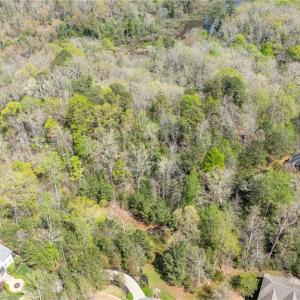 Aerial view of property from above cul de sac looking east