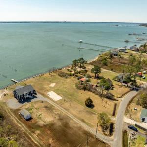 Concrete pad for 3 bay garage, riprap, boatramp, well &septic all in place