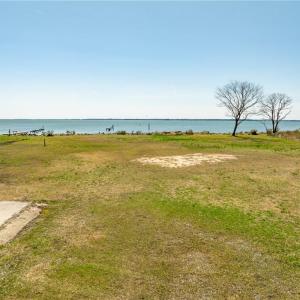 Concrete pad for 3 bay garage, riprap, boat ramp, well and septic all in place