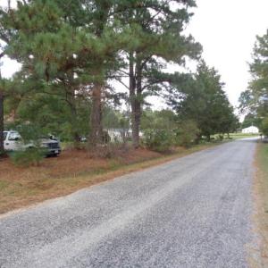 LOT NEAR HOUSES, PAVED ROADS
