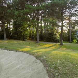 The view of the lot from the fairway of the 6th hole