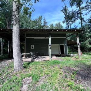 Two story barn with great deck upstairs.