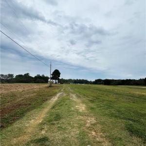 Private driveway spans the entire length of the property.