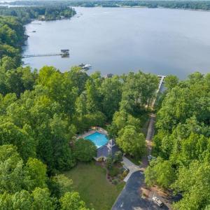 Community amenities include a pool w/covered patio area, boat ramp & dock on gorgeous Pianktank River, private sandy beach, walking trails & RV/boat trailer storage area.