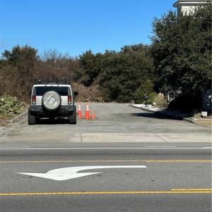 Please park here and walk the site.