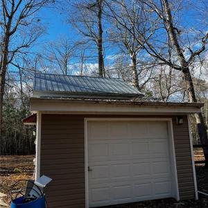 Utility shed with agricultural well and on stall horse barn.