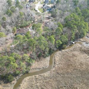 Creek extends to tip of lot