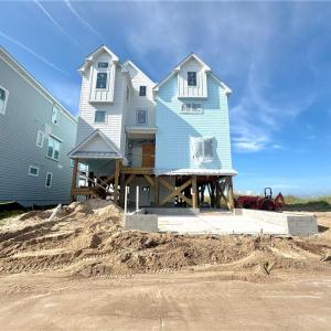 New construction home being built on neighboring lot