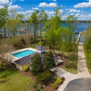 View of pool, boat ramp and dock