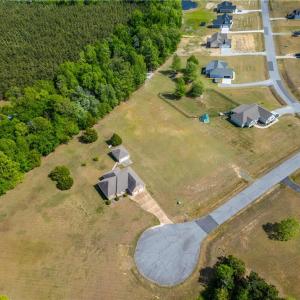 View from the land showing some other homes in this established Bethel Farms community.