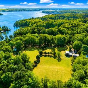 Overview of land with water frontage through small tree line