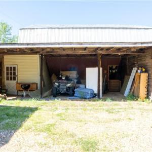 Additional storage beside the barn under cover