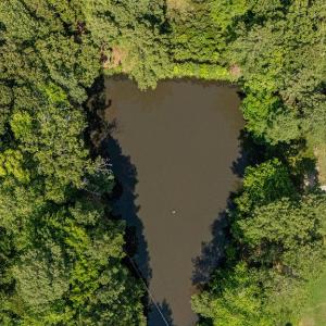 a portion of the 14.05 acres shares the pond.