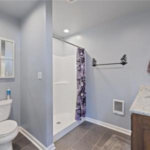 Full bath to right of kitchen and separate utility closet with washer/dryer/water heater.