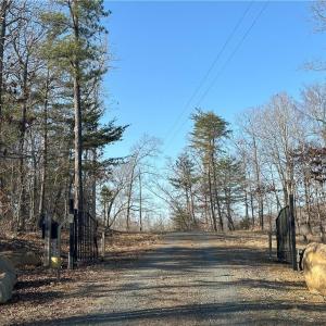 Property line runs along powerlines and you'll see purple end stakes for estimated lines.