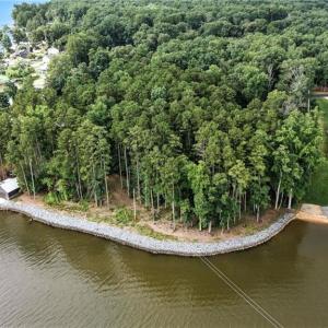 Waterfront lot begins just to the left of the home on the right.