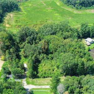 2.5 acres (lot sits between new construction residence to the left and lake-side residence to the right)