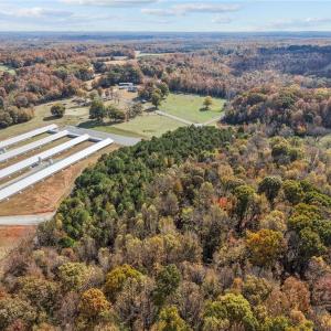 Aerial view of vacant land and farm. Lot lines and dimensions are approximate.