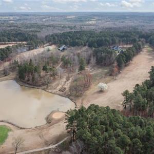 Aerial view of the 18th green and fairway, Lot 54 is in the middle of the photo at teh back of the lake.