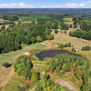 Aerial view of the 18th green and fairway, Lot 54 is in the middle of the photo at the back of the lake.