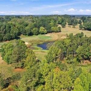 Aerial view of Lot 54 Caswell Pines with the lake behind it.