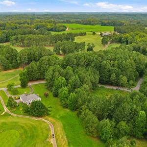 Aerial view of the property (lot 24) and 115 Oak Tree Drive.