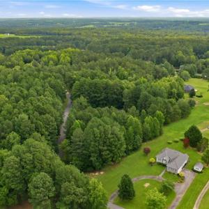 Aerial view of the property (lot 24) and 115 Oak Tree Drive to Club House Drive.
