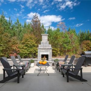 Concrete block fireplace w/ built-in bench wall