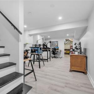 Finished basement area, perfect for workshop/craft area