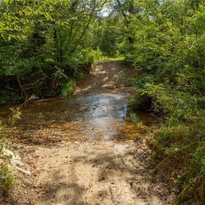 Here is access to the property.  30 foot easement off Wright Road (Private Road) provides access to the property.    Wright Road is an old farm road and rugged in spots.  4 WHEELED DRIVE VEHICLE IS REQUIRED TO  FORD THE CREEK AND ACCESS THE PROPERTY.