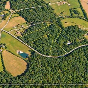 Wooded Homesite Acreage Near Chapel Hill NC. Aerial view of the 20.65 acre parcel with nearby farms and homes. Room for a private homesite, barn or mini farm in Orange County, NC. Outline approximate.