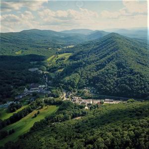 Homestead Surrounded by Lush Green Mount