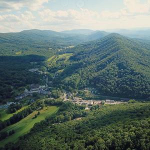 Homestead Surrounded by Lush Green Mount