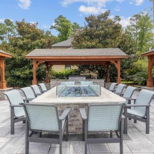 View of patio / terrace featuring an outdoor fire