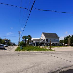 View of asphalt street featuring a residential vie
