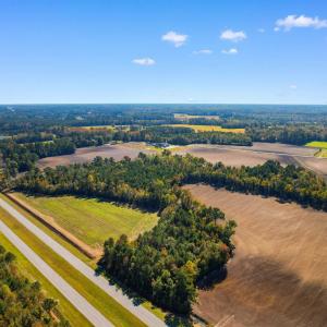 Birds eye view of property featuring a rural view