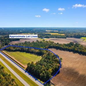 Birds eye view of property featuring a rural view
