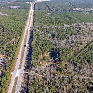 Birds eye view of property featuring a rural view