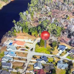 Bird's eye view featuring a water view and a resid