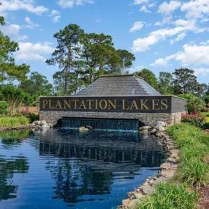 Community sign featuring a water view