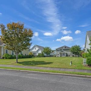 Exterior space with a front yard, board and batten