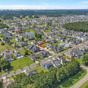 Aerial view of property and surrounding area with