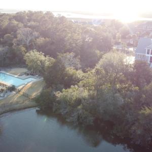 Birds eye view of property with a water view