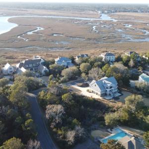 Birds eye view of property with a water view