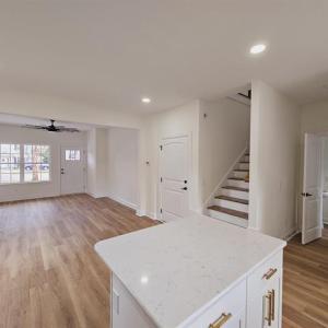 Kitchen with open floor plan, light countertops, a
