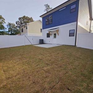 Back of property at dusk featuring a fenced backya