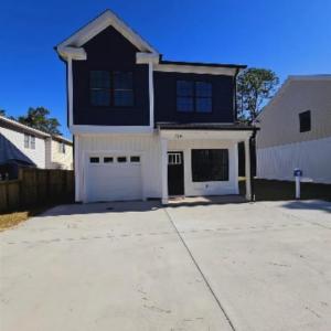 View of front of property with board and batten si