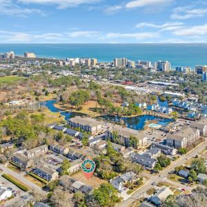 Drone / aerial view featuring a water view and a c