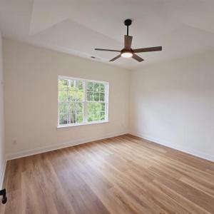 Unfurnished room with light wood-style floors, cei