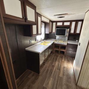 Kitchen featuring light countertops, stainless ste